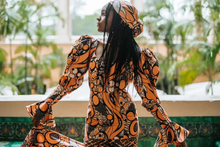 This is an image of a lady wearing a custom made ethnic dress made by Betzabe Pujaico Designs in North Miami, FL.