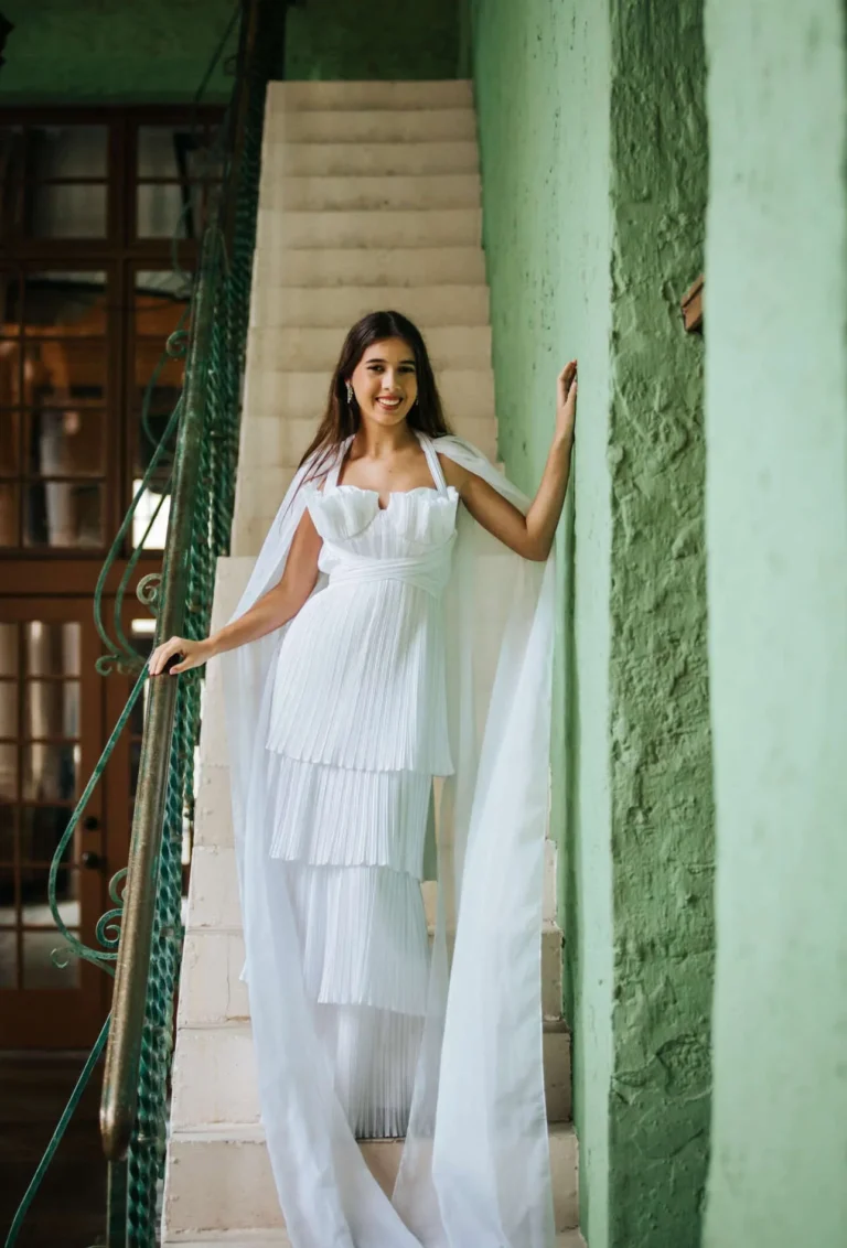 This is an image of a lady wearing a custom made formal dress made by Betzabe Pujaico Designs in North Miami, FL.