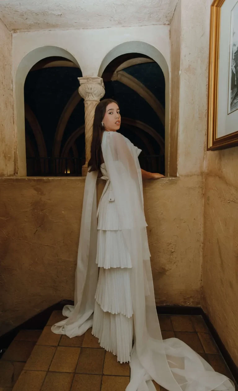 This is an image of a lady wearing a custom made formal dress made by Betzabe Pujaico Designs in North Miami, FL.