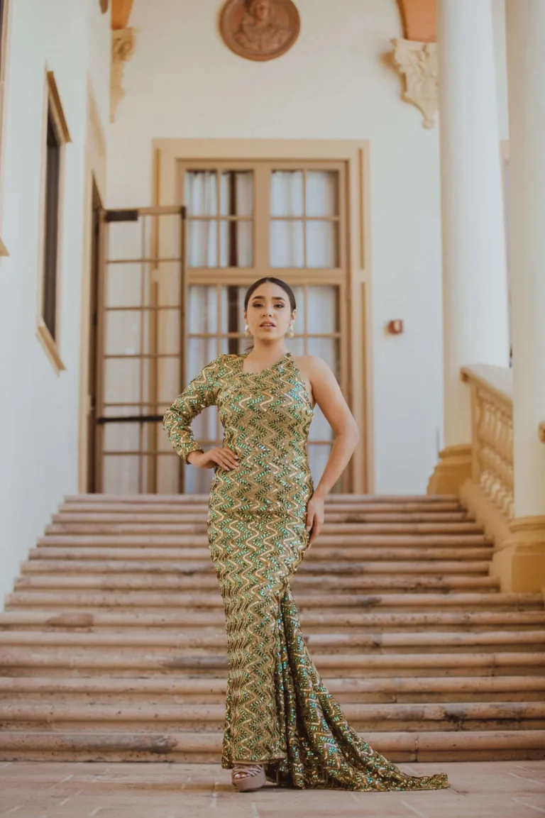 This is an image of a lady wearing a custom made formal dress made by Betzabe Pujaico Designs in North Miami, FL.