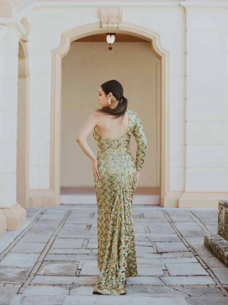 This is an image of a lady wearing a custom made formal dress made by Betzabe Pujaico Designs in North Miami, FL.