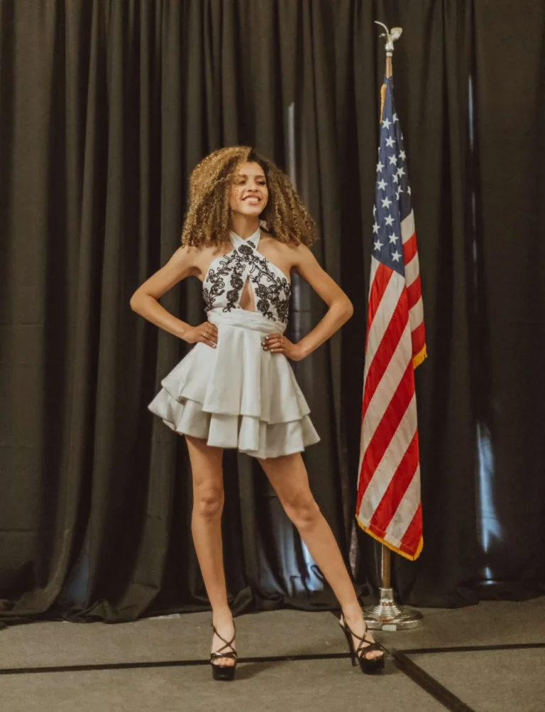 This is an image of a lady wearing a custom made formal dress made by Betzabe Pujaico Designs in North Miami, FL.