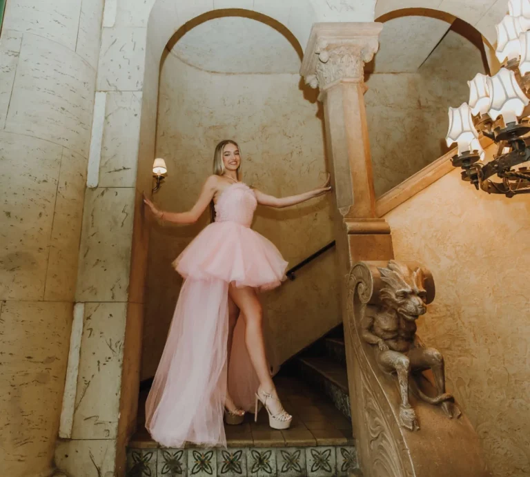 This is an image of a lady wearing a custom made formal dress made by Betzabe Pujaico Designs in North Miami, FL.