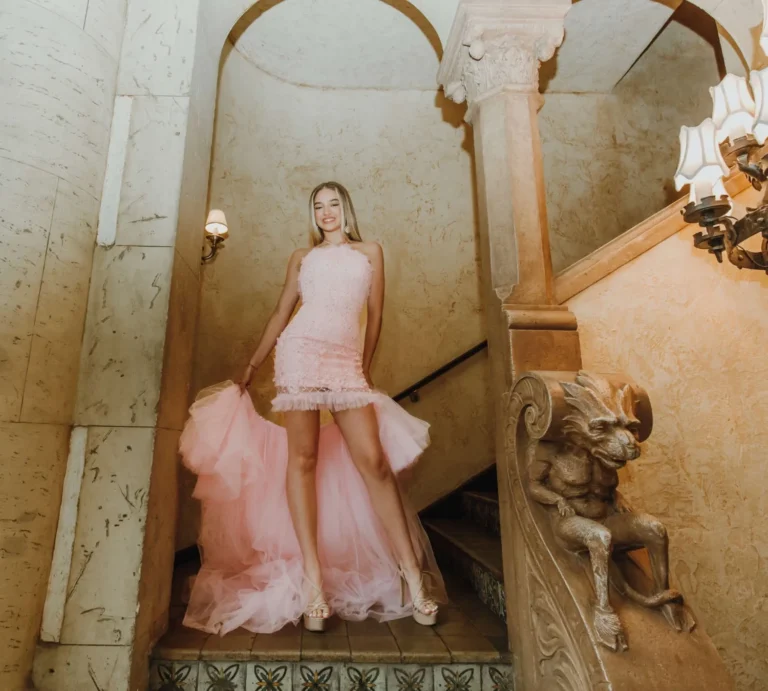 This is an image of a lady wearing a custom made formal dress made by Betzabe Pujaico Designs in North Miami, FL.