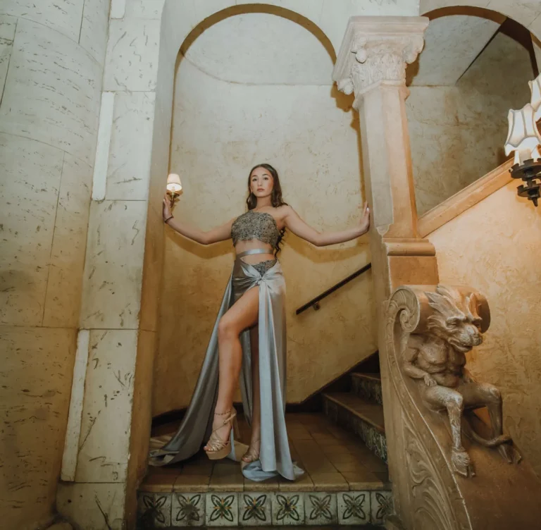 This is an image of a lady wearing a custom made formal dress made by Betzabe Pujaico Designs in North Miami, FL.