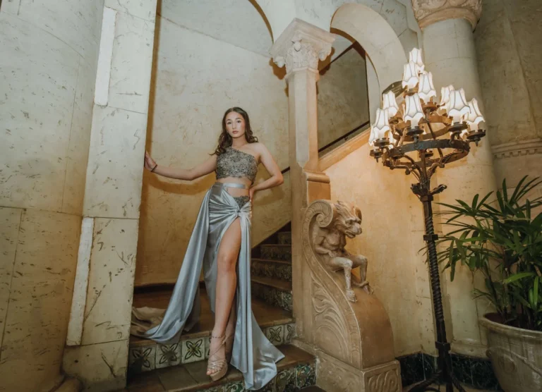 This is an image of a lady wearing a custom made formal dress made by Betzabe Pujaico Designs in North Miami, FL.