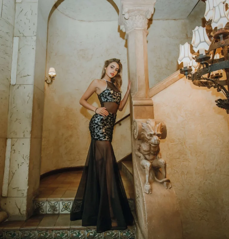 This is an image of a lady wearing a custom made formal dress made by Betzabe Pujaico Designs in North Miami, FL.