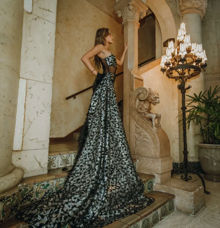 This is an image of a lady wearing a custom made formal dress made by Betzabe Pujaico Designs in North Miami, FL.