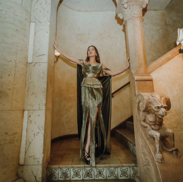 This is an image of a lady wearing a custom made formal dress made by Betzabe Pujaico Designs in North Miami, FL.