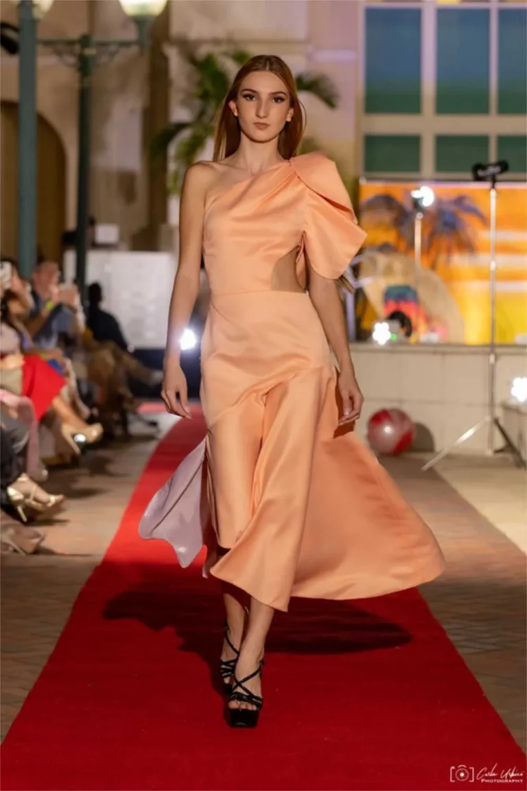 This is an image of a lady wearing a custom made gala dress made by Betzabe Pujaico Designs in North Miami, FL.