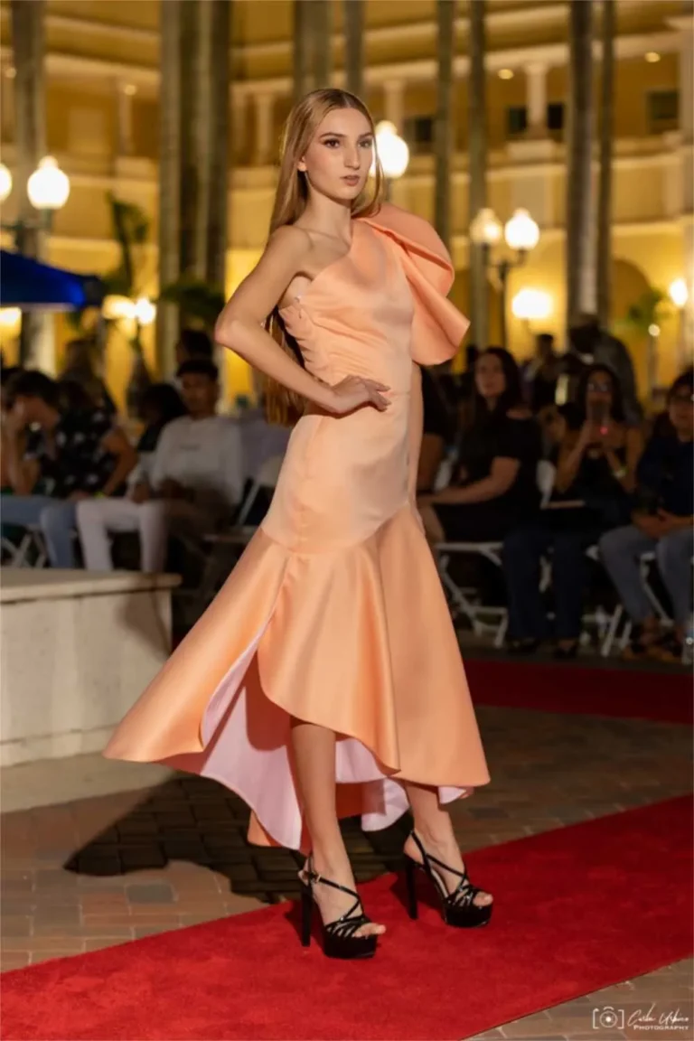 This is an image of a lady wearing a custom made gala dress made by Betzabe Pujaico Designs in North Miami, FL.