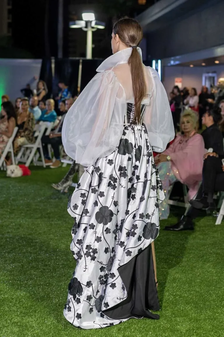 This is an image of a lady wearing a custom made gala dress made by Betzabe Pujaico Designs in North Miami, FL.