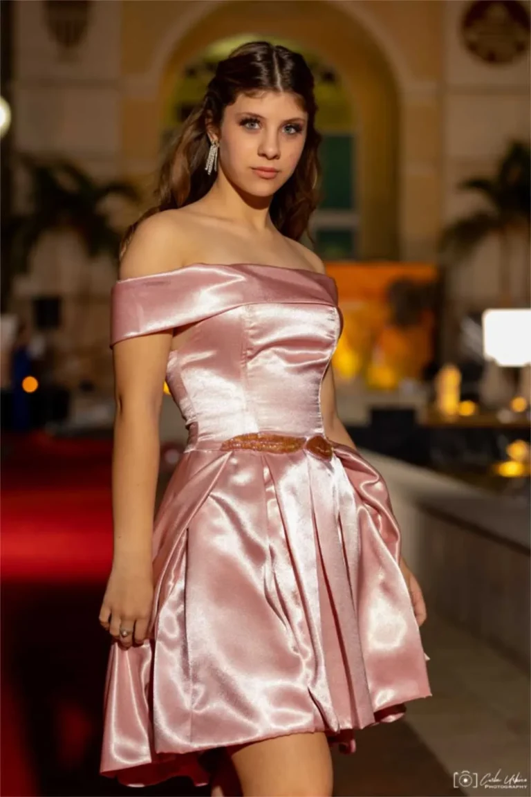 This is an image of a lady wearing a custom made gala dress made by Betzabe Pujaico Designs in North Miami, FL.