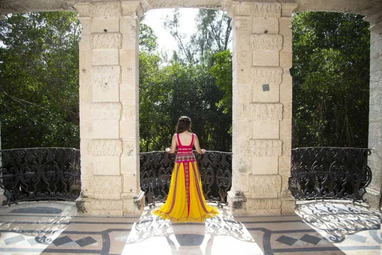 This is an image of a lady wearing a custom made inca style dress made by Betzabe Pujaico Designs in North Miami, FL.