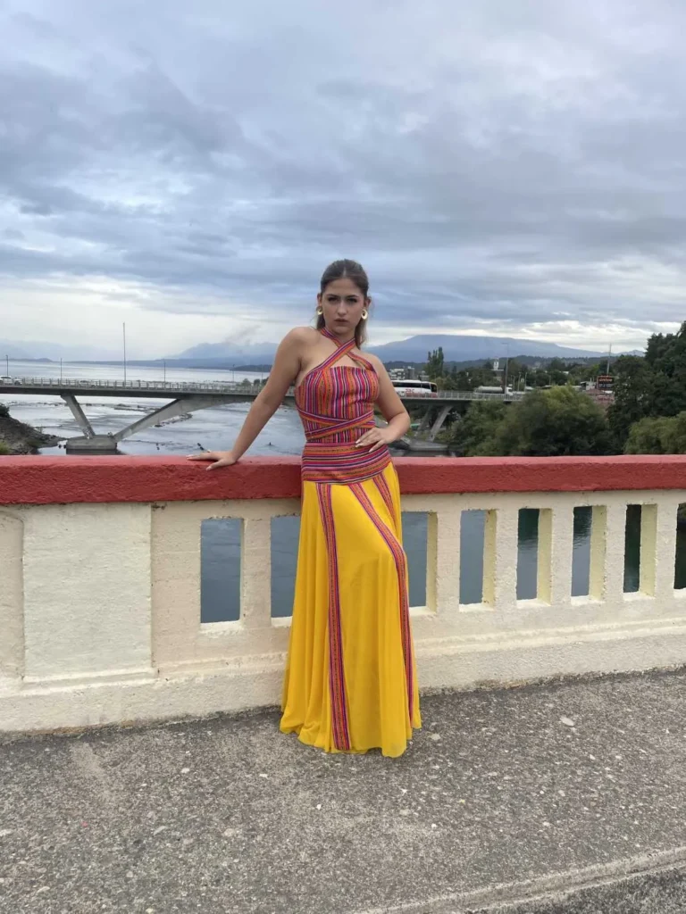 This is an image of a lady wearing a custom made inca style dress made by Betzabe Pujaico Designs in North Miami, FL.