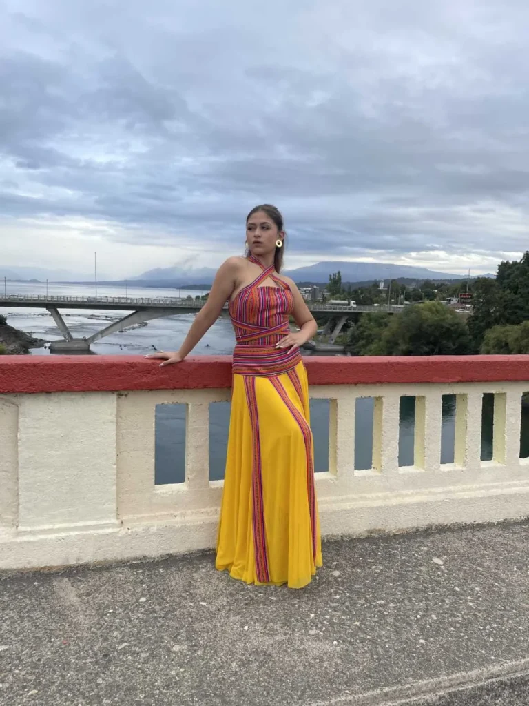 This is an image of a lady wearing a custom made inca style dress made by Betzabe Pujaico Designs in North Miami, FL.