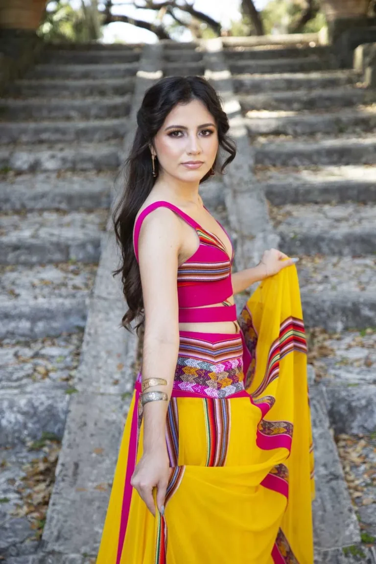 This is an image of a lady wearing a custom made inca style dress made by Betzabe Pujaico Designs in North Miami, FL.