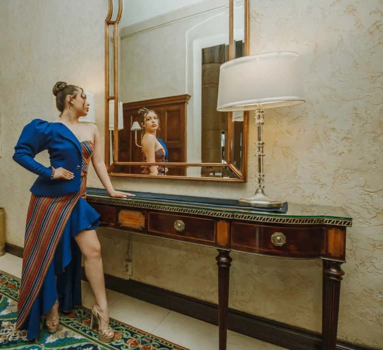 This is an image of a lady wearing a custom made inca style dress made by Betzabe Pujaico Designs in North Miami, FL.