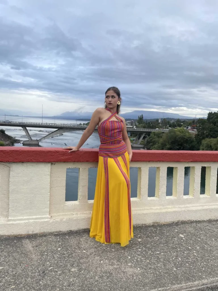 This is an image of a lady wearing a custom made inca style dress made by Betzabe Pujaico Designs in North Miami, FL.