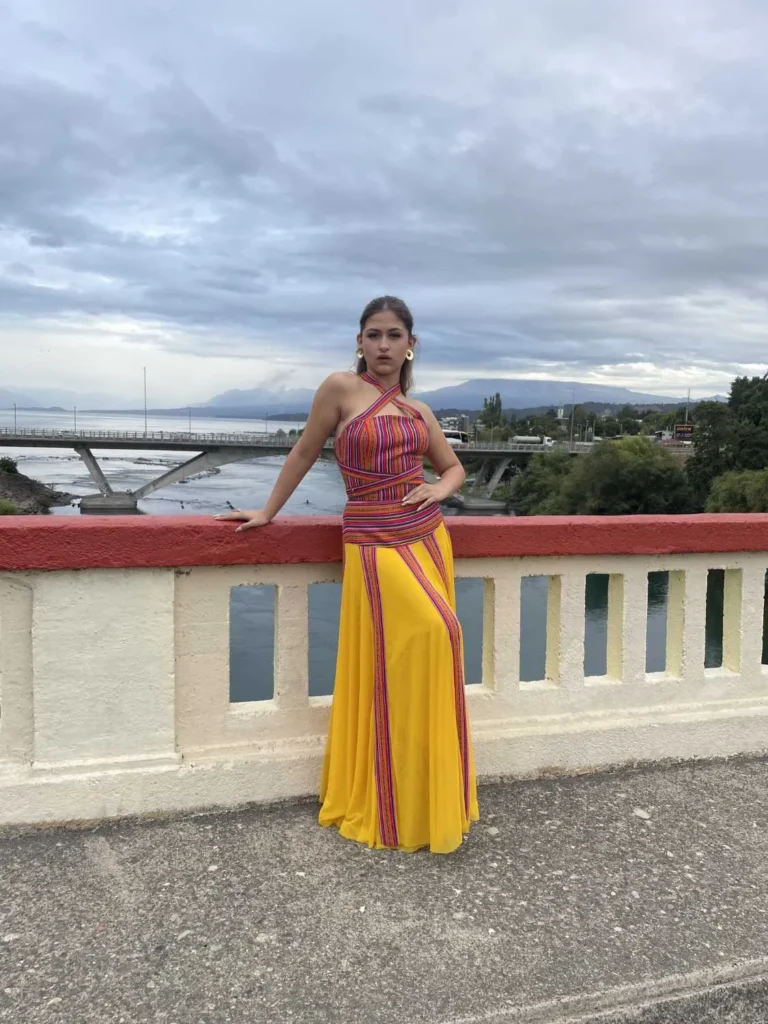 This is an image of a lady wearing a custom made inca style dress made by Betzabe Pujaico Designs in North Miami, FL.