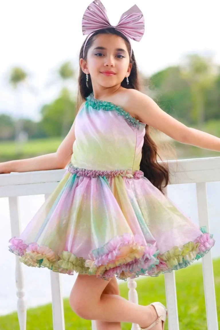 This is an image of a lady wearing a custom made outfits for children made by Betzabe Pujaico Designs in North Miami, FL.
