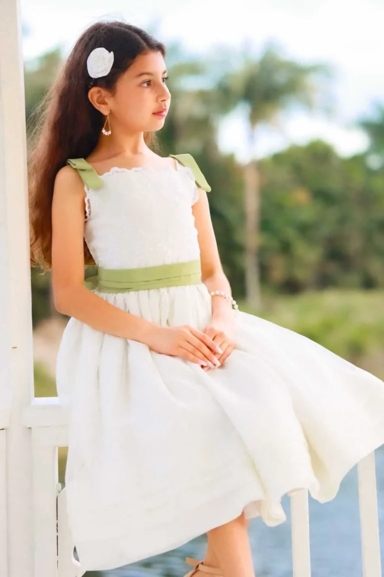 This is an image of a lady wearing a custom made outfits for children made by Betzabe Pujaico Designs in North Miami, FL.