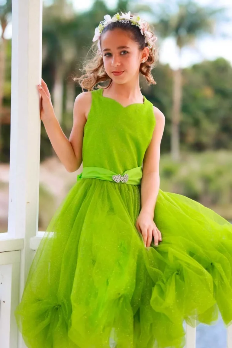 This is an image of a lady wearing a custom made outfits for children made by Betzabe Pujaico Designs in North Miami, FL.