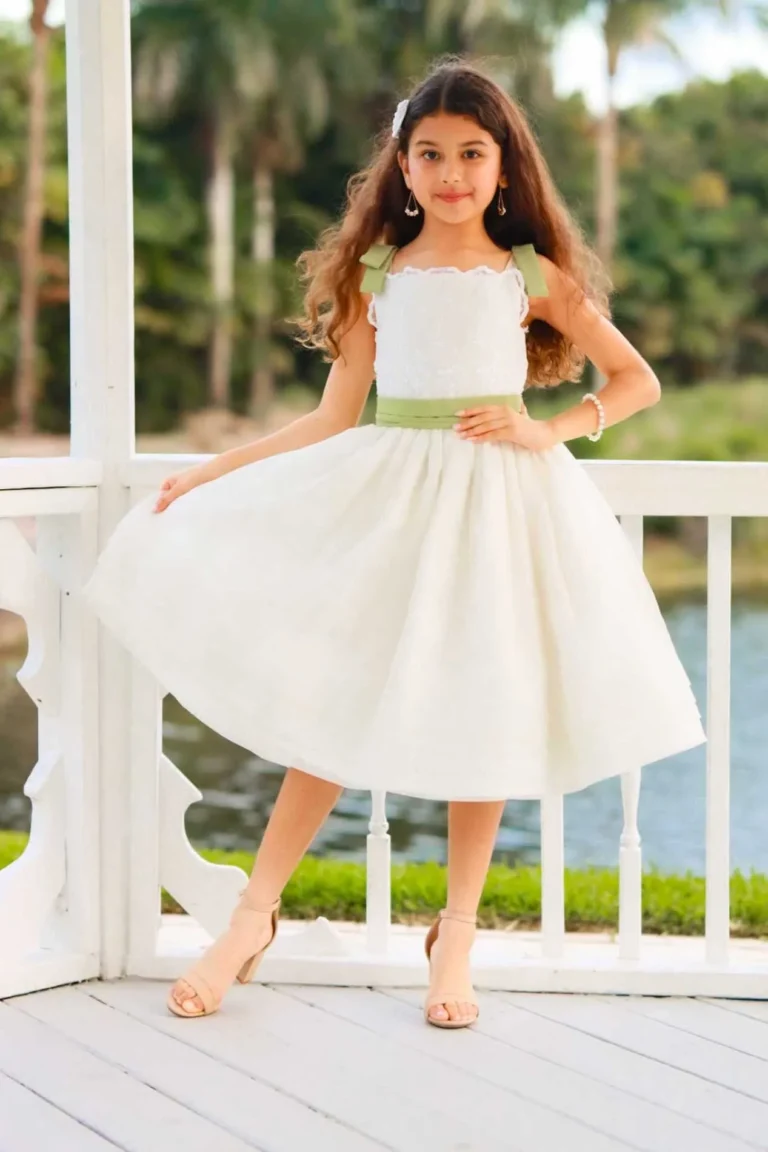 This is an image of a lady wearing a custom made outfits for children made by Betzabe Pujaico Designs in North Miami, FL.