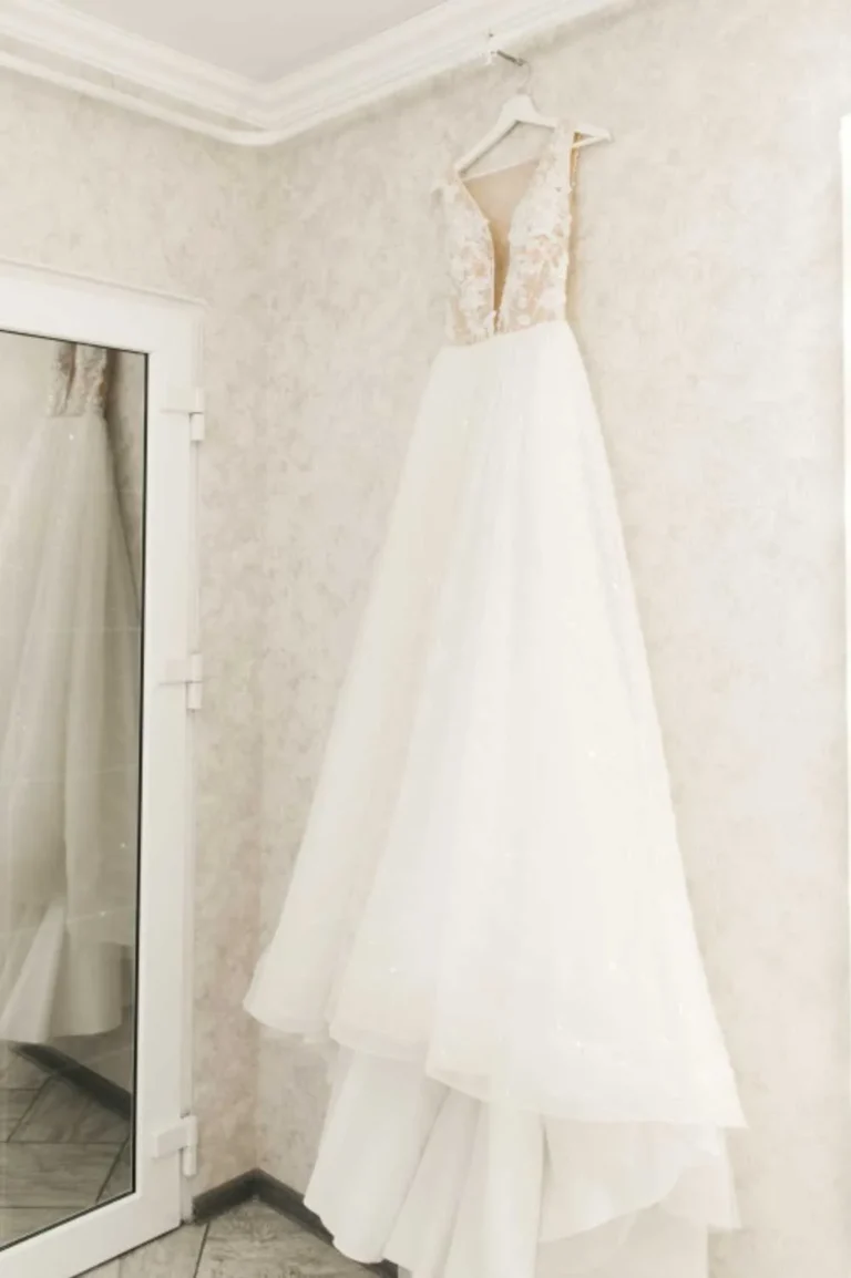 This is an image of a lady wearing a custom made wedding dress made by Betzabe Pujaico Designs in North Miami, FL.